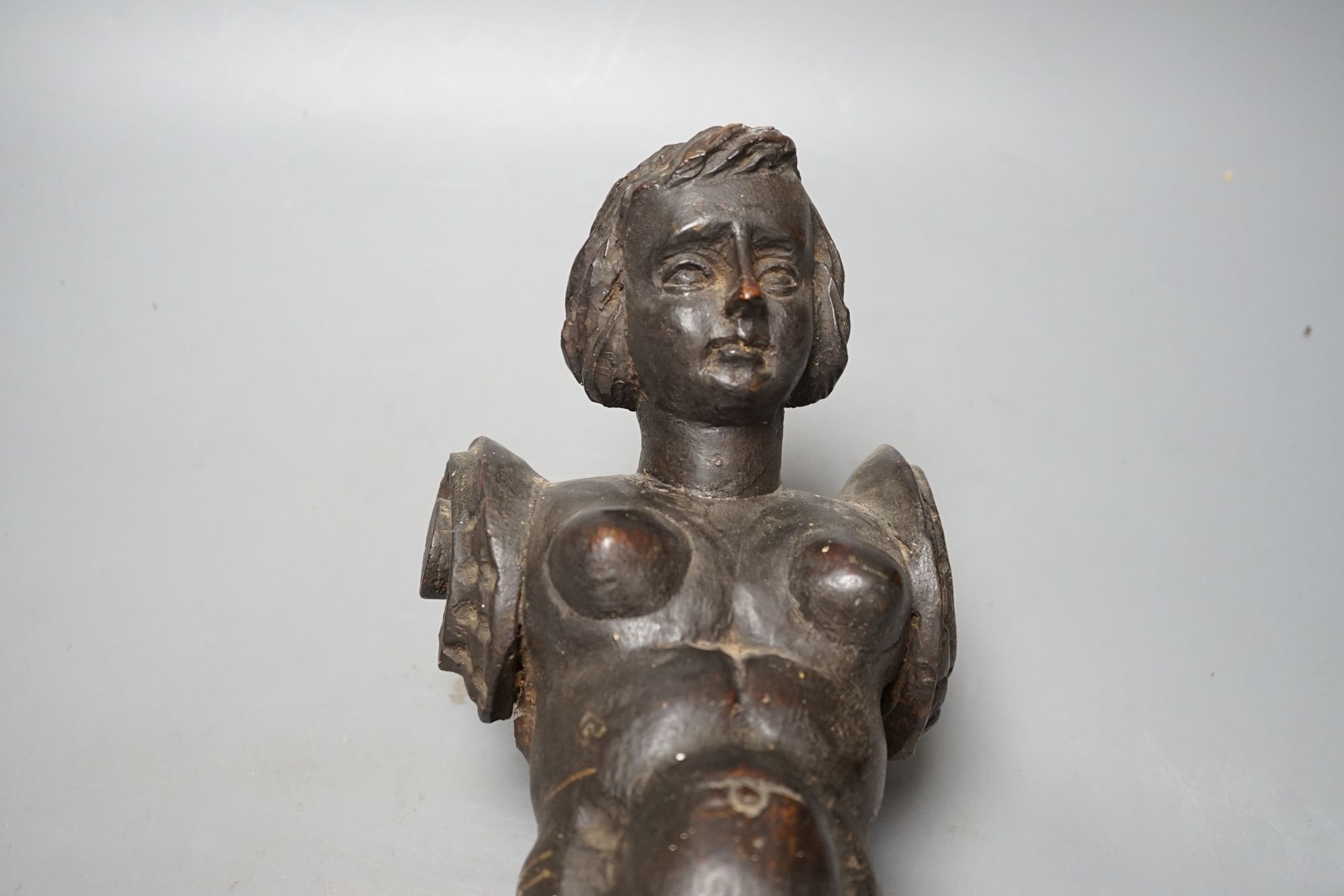 An 18th century Italian carved walnut or beech terminal figure, 38cm
